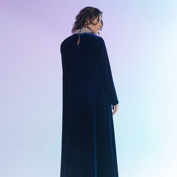 A velvet dress with hand embroidery inspired by the heritage of the Najd region