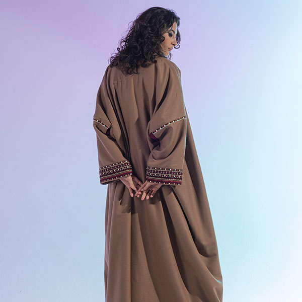 Hand-embroidered woolen womens bisht reflects the heritage of the Hijaz region