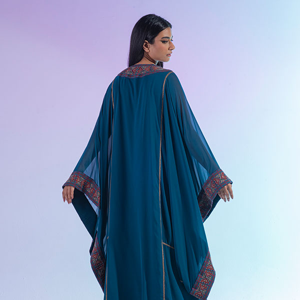 A traditional Najdi dress made of bisht material, hand embroidered