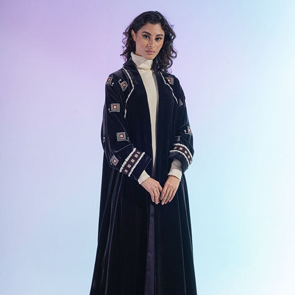 An abaya made of velvet material decorated with hand embroidery, inspired by the Hijaz region