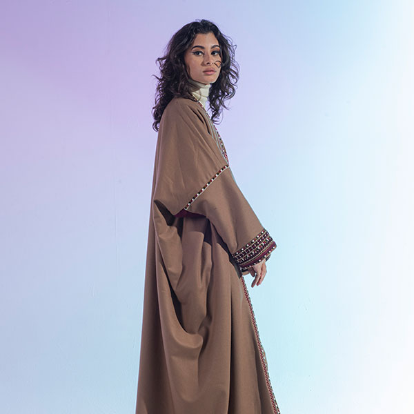 Hand-embroidered woolen womens bisht reflects the heritage of the Hijaz region