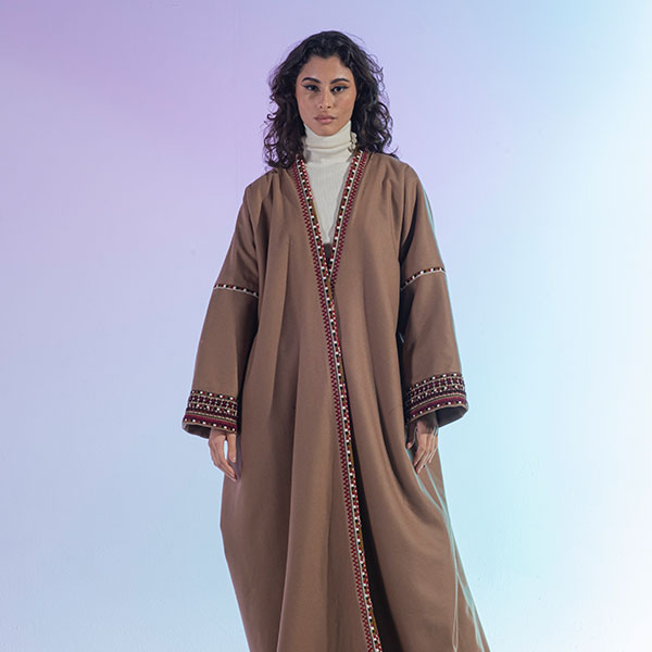 Hand-embroidered woolen womens bisht reflects the heritage of the Hijaz region