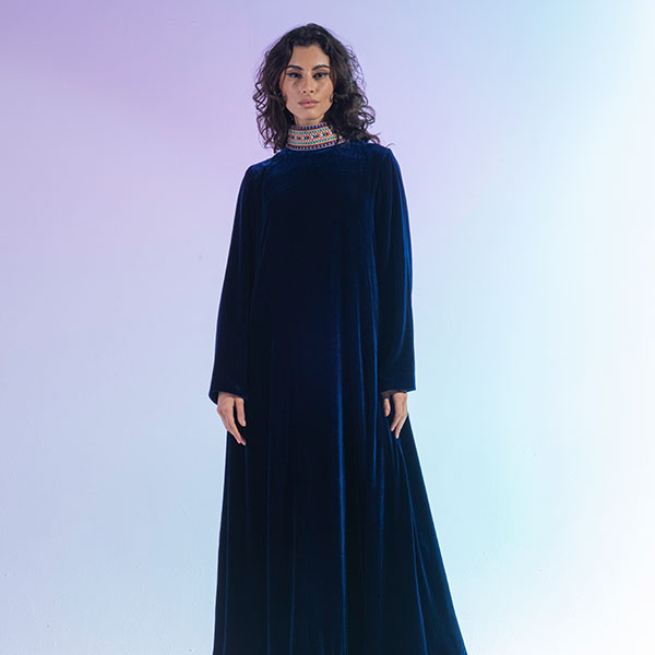 A velvet dress with hand embroidery inspired by the heritage of the Najd region