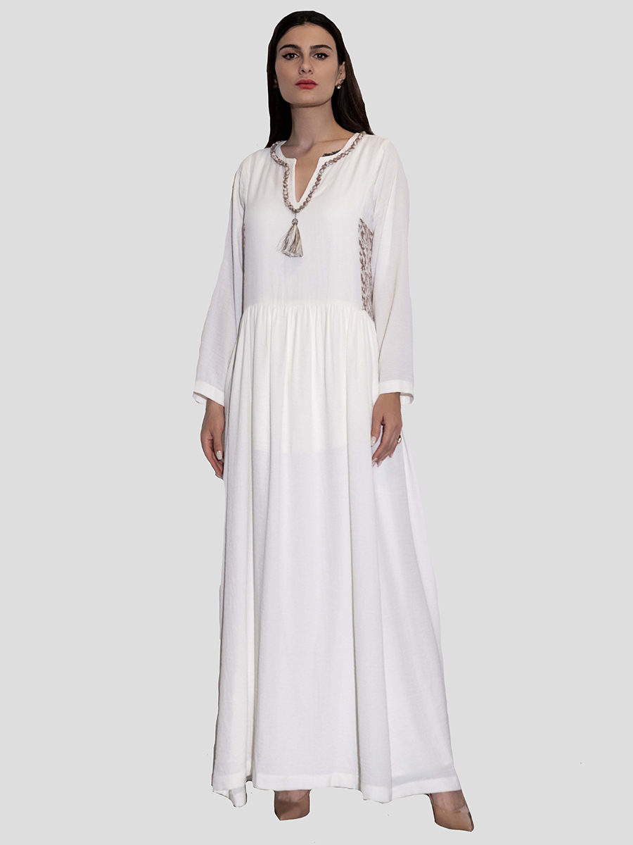 white dress with embroidery on the waist