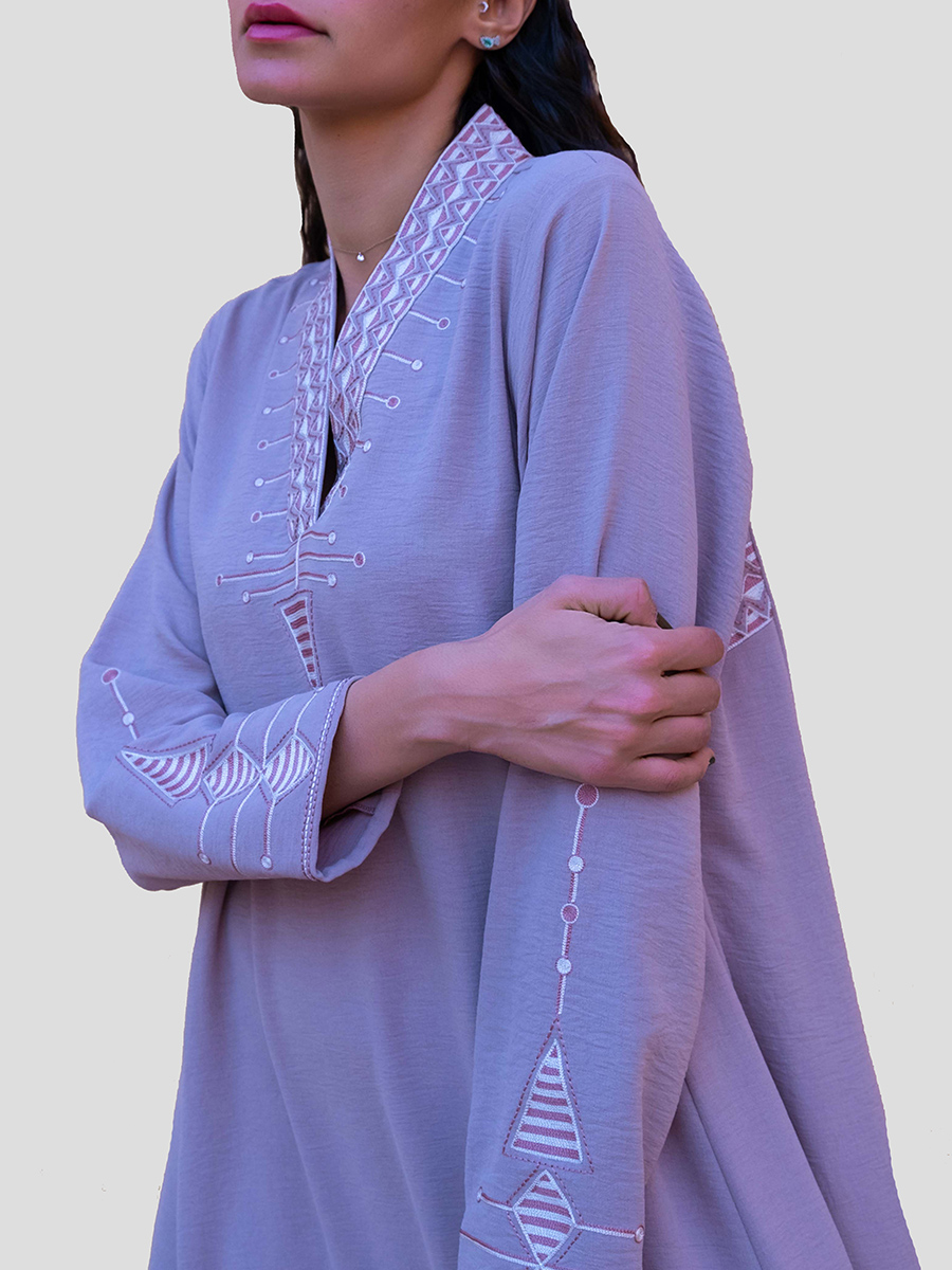 lavander dress with embroidery on neck and sleeves