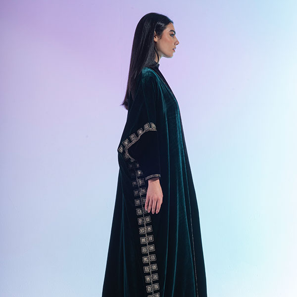 An abaya made of velvet material decorated with hand embroidery, inspired by the Hijaz region