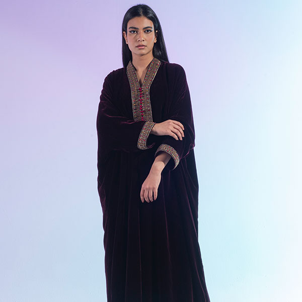 A velvet dress with hand embroidery inspired by the heritage of the Najd region